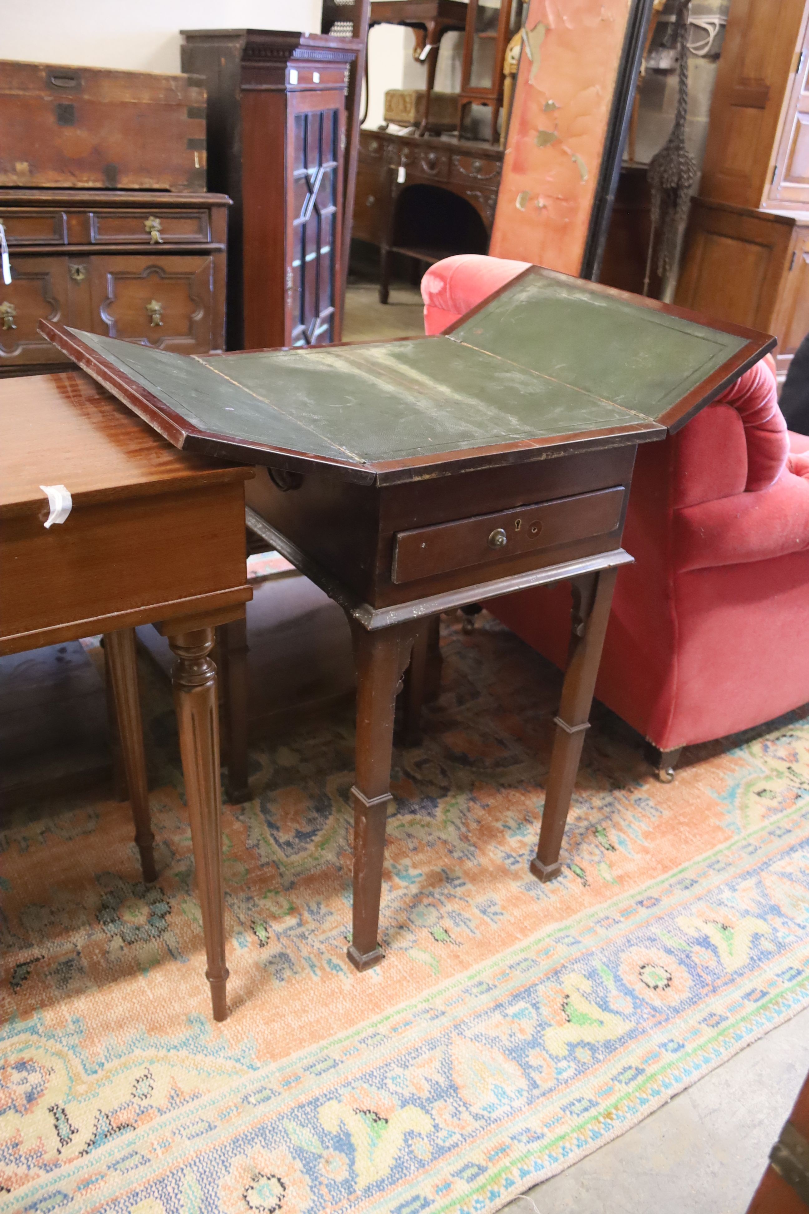 A Victorian mahogany writing/work table with twin hinged flap top, width 42cm, depth 50cm, height 77cm